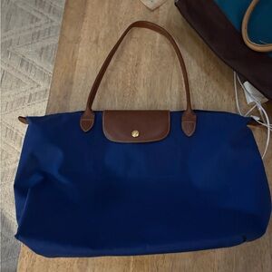 Longchamp  Le pliage  bought in Paris . Has small hole on edges